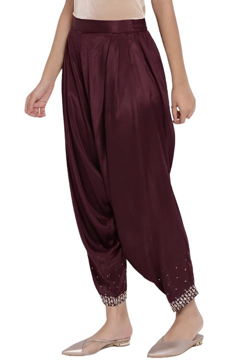 Wine Solid Draped Pants in Germany