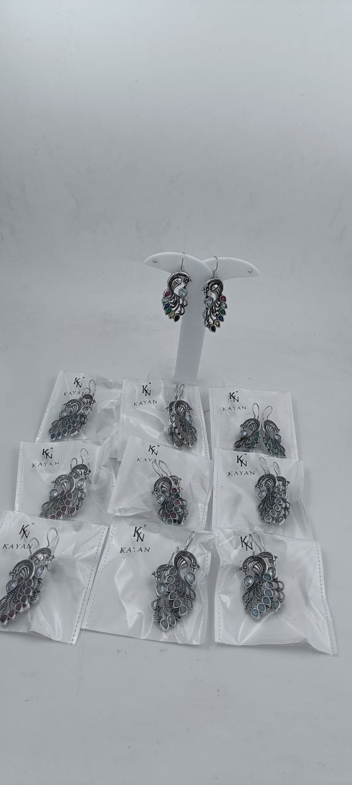 Peacock Gemstone Studded Intricate Oxidised Silver Plated Earrings in Munich