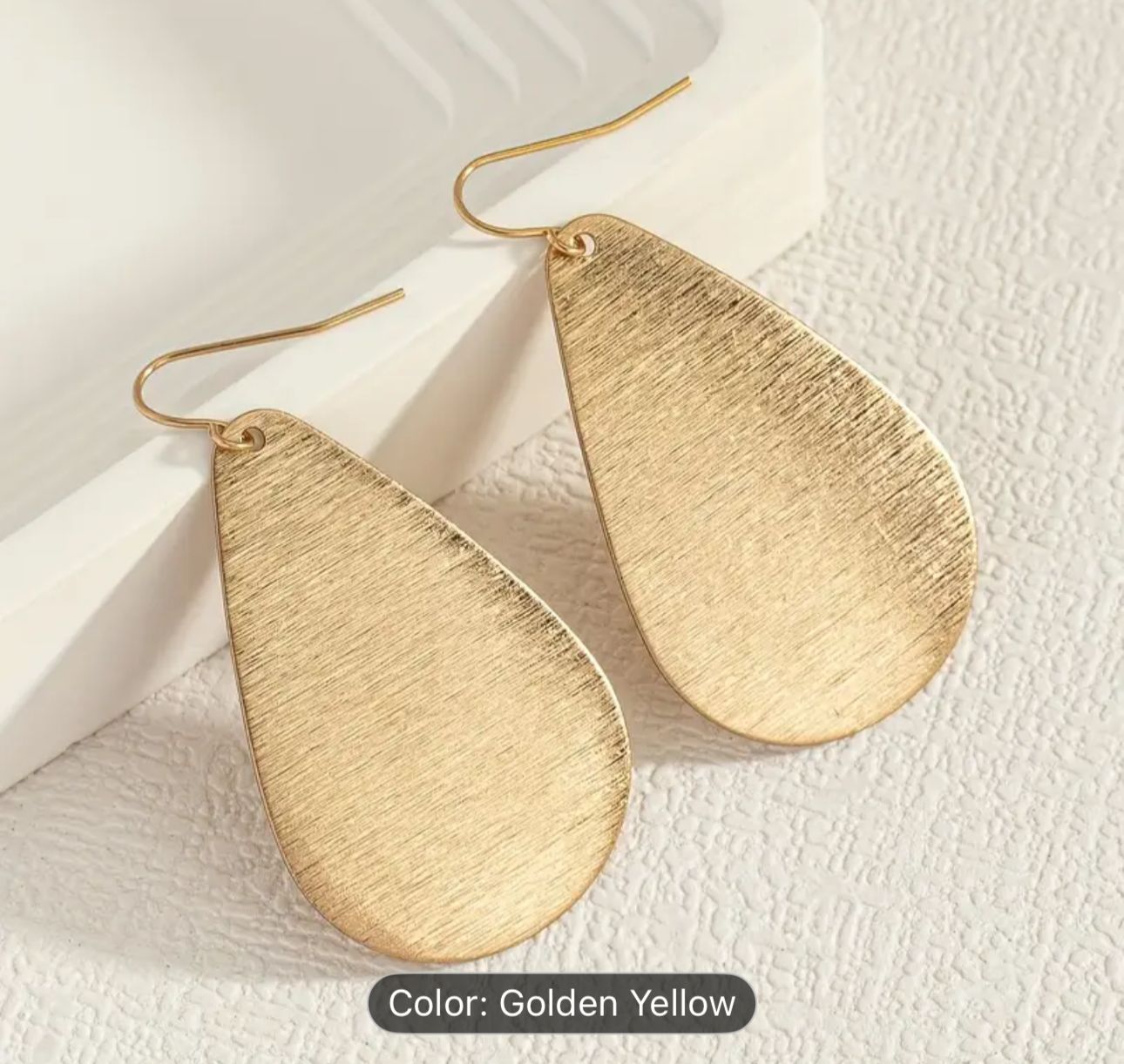 Golden Brushed Metal Teardrop-Shaped Earrings in Germany