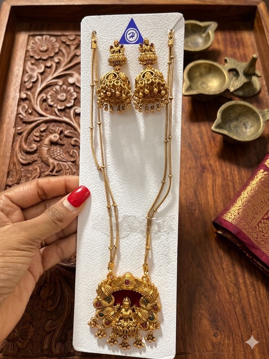Gold-plated Goddess Lakshmi pendant and matching peacock jhumka earrings in Germany