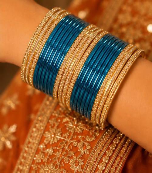 Teal and gold traditional bangle set in Germany