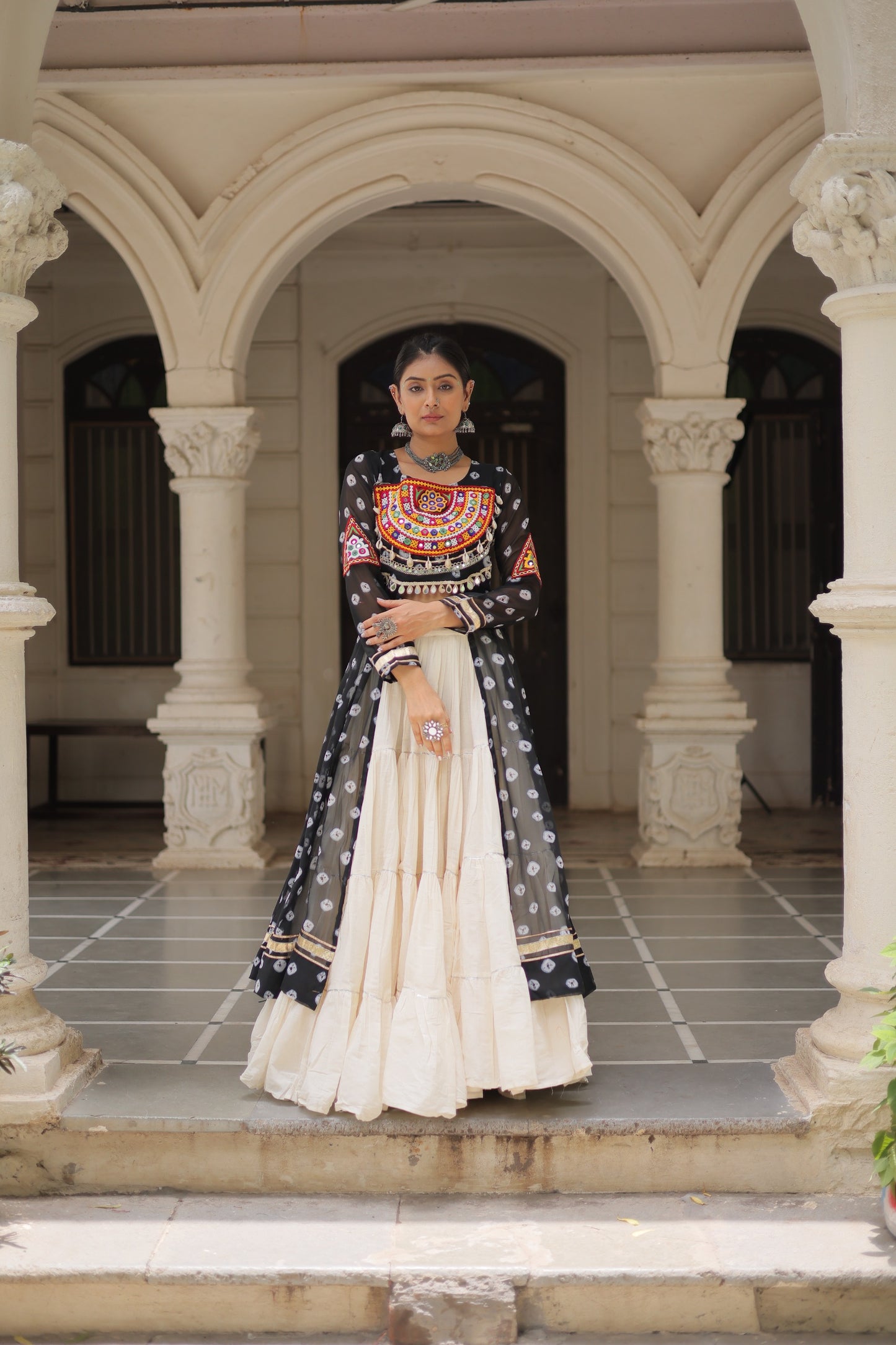 Black Bandhani Front-Slit Kurti and Off-White Lehenga Set in Germany