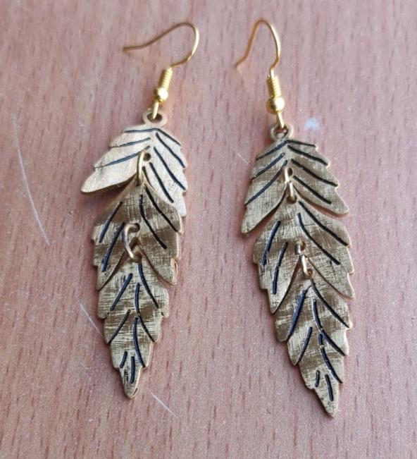 Gold Feather Leaf Brass Dangle Earrings with Detailed Cutout Design in Berlin