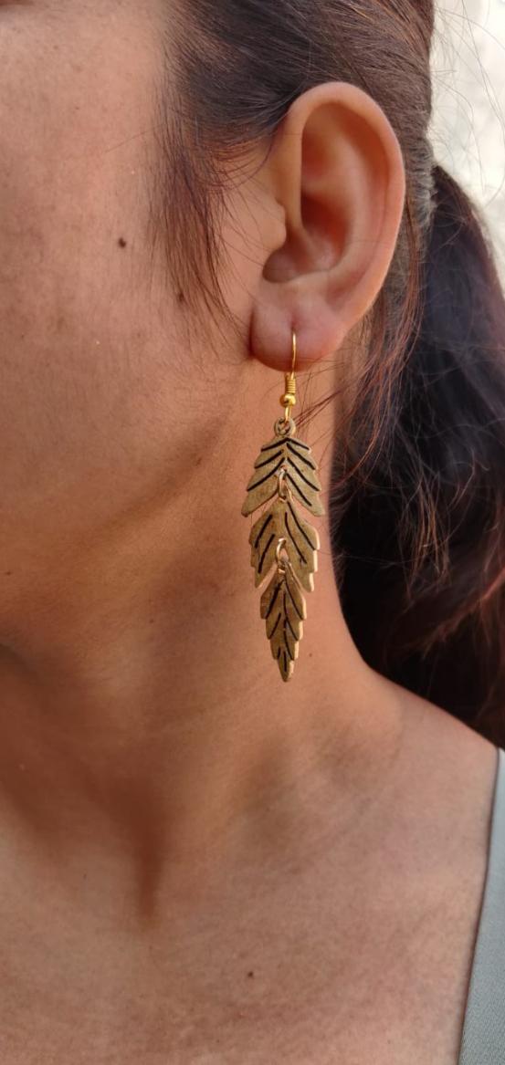 Gold Feather Leaf Brass Dangle Earrings with Detailed Cutout Design in Berlin