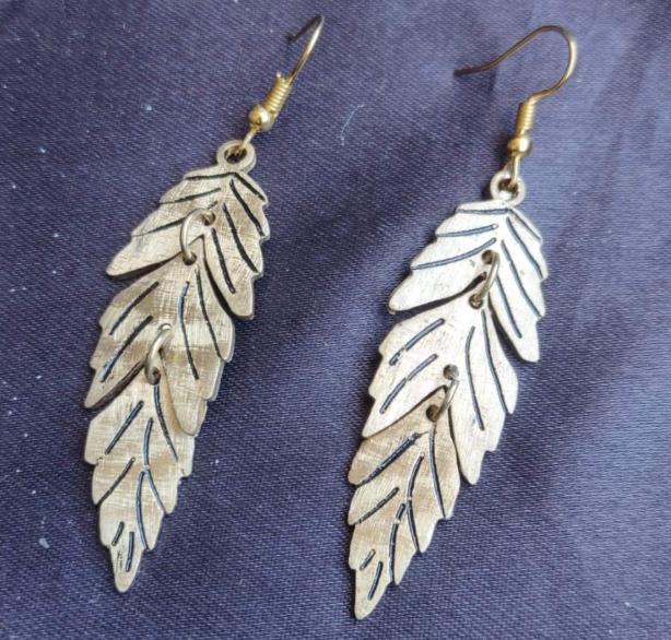Gold Feather Leaf Brass Dangle Earrings with Detailed Cutout Design in Berlin