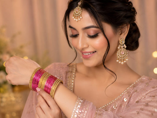 Meganta and gold traditional bangle set in Germany