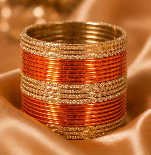 Orange and gold traditional bangle set in Germany