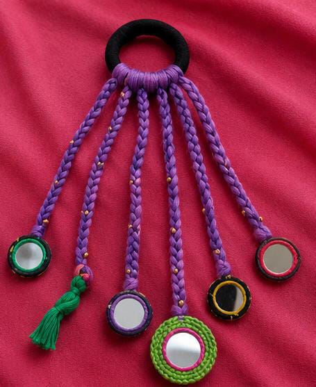 Elegant Festive Ponytail with Purple Mirror-Work Paranda in Germany