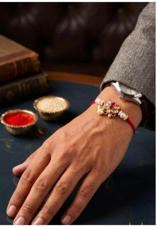 Traditional Designer Kundan and Pearl Rakhi on Wrist for Raksha Bandhan in Germany