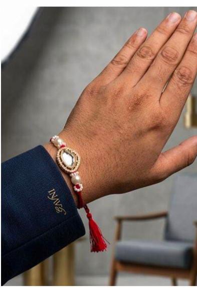 Traditional Kundan and Pearl Brother Rakhi on Wrist in Germany