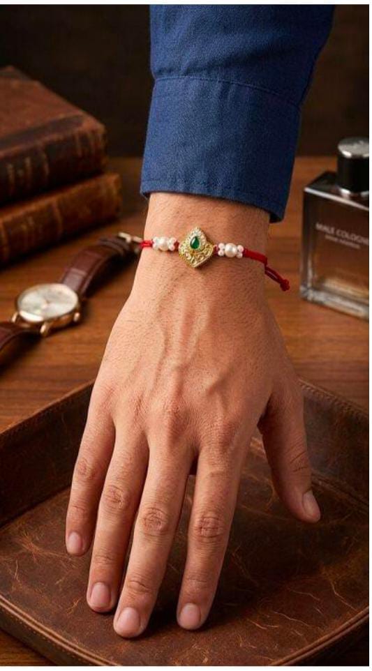 Elegant Handcrafted Kundan and Pearl Rakhi on Wrist in Germany