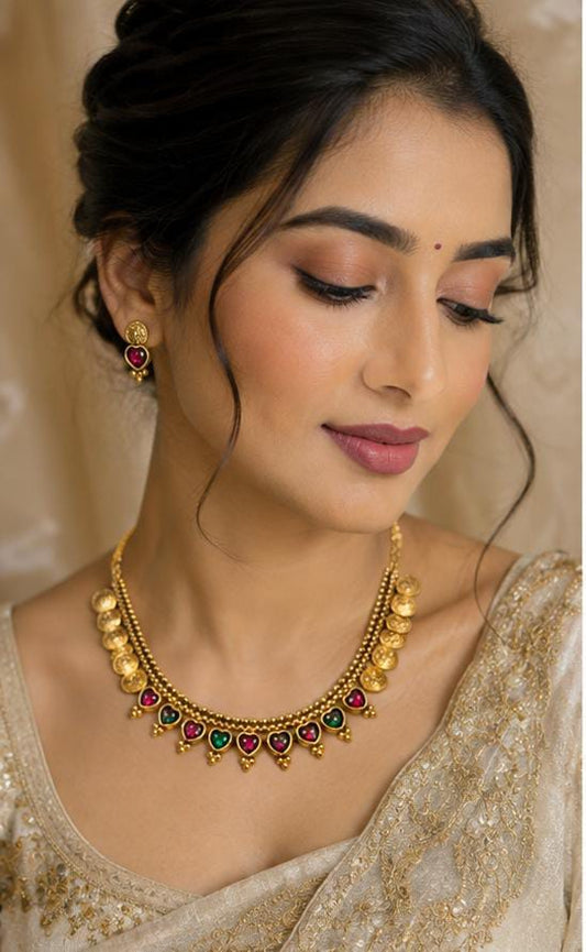 Antique Gold Finish Traditional Elakkathali Coin Necklace Set with Kemp Accents Earrings in Germany