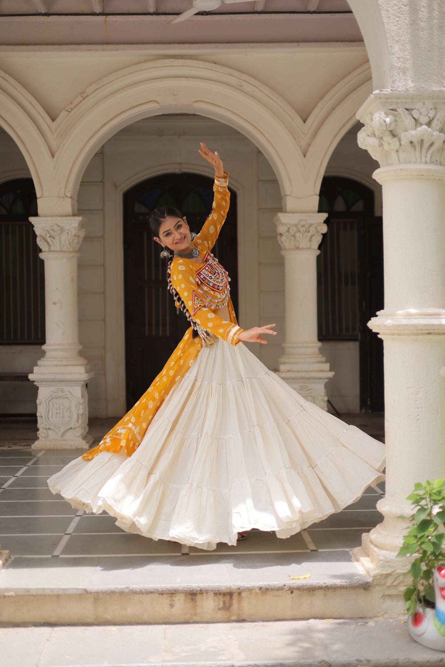 Yellow Bandhani Front-Slit Kurti and Off-White Lehenga Set in Germany