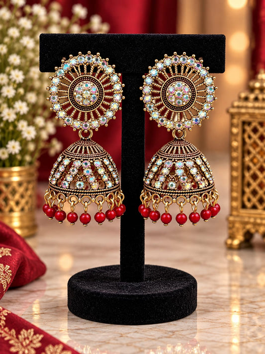 Traditional Antique Gold-Plated Jhumka Earrings with Aurora Borealis Crystals and Red Beads in Germany